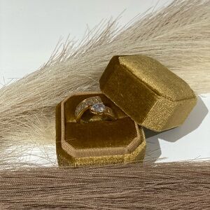 Luxurious Gold and White Ring with Central Stone